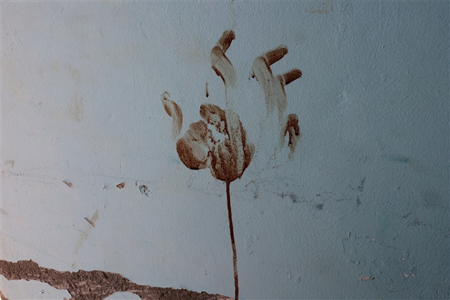 A bloody handprint inside a house at the Nir Oz kibbutz October 2023